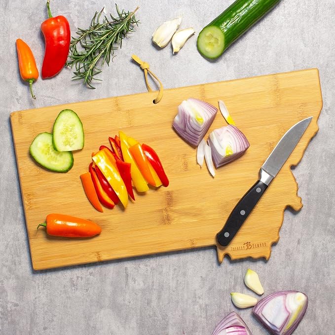 Totally Bamboo Montana State Shaped Cutting Board, Summer Stokes Art | State charcuterie board with colorful hand-drawn landscape art. Smooth reverse side for food prep. Hang tie for wall display.
