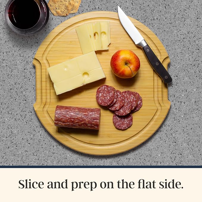 Totally Bamboo Flip, Serve & Store Reversible Charcuterie Board with Lid | Round portable serving board with 5 compartments and locking travel cover. Cutting side includes juice groove for prep.