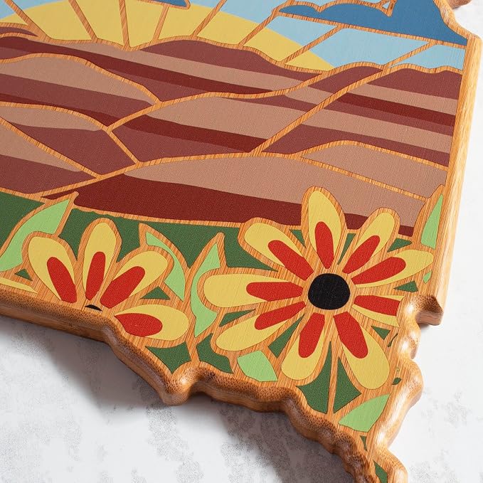 Totally Bamboo South Dakota State Shaped Cutting Board, Summer Stokes Art | State charcuterie board with colorful hand-drawn landscape art. Smooth reverse side for food prep. Hang tie for wall display.