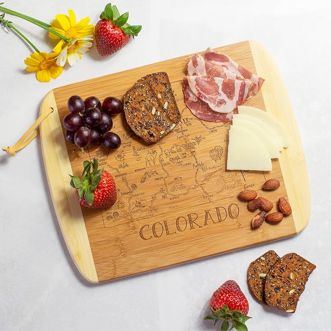 Totally Bamboo A Slice of Life Colorado Engraved Map Cutting Board | 11” x 8.75” charcuterie board with engraved state map artwork. Smooth reverse side for food prep. Hang tie for wall display.