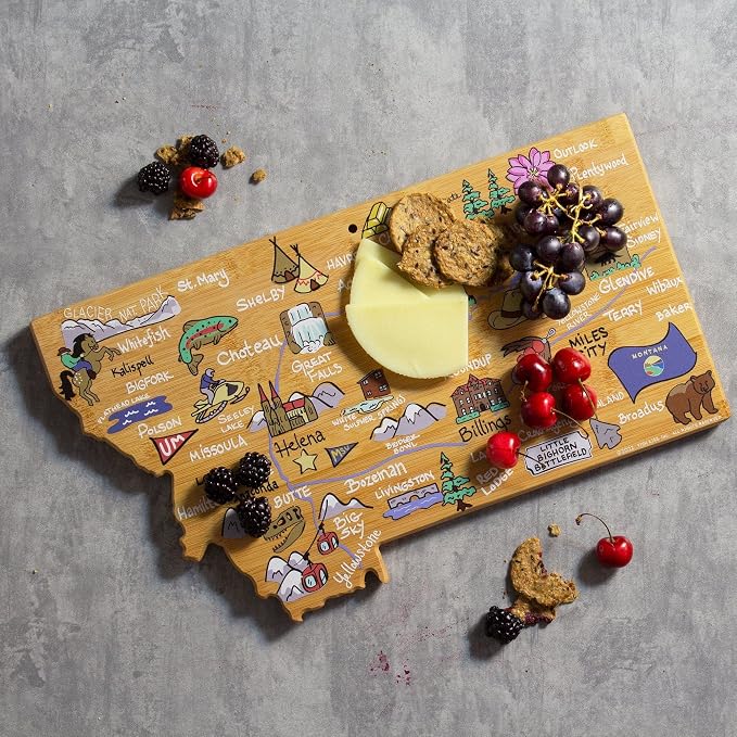 Totally Bamboo Montana State Shaped Cutting Board, Art by Fish Kiss | State charcuterie board with colorful hand-drawn map artwork. Smooth reverse side for food prep. Hang tie for wall display.