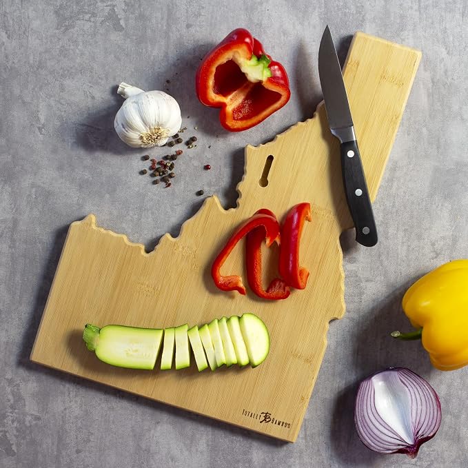 Totally Bamboo Idaho State Shaped Cutting Board, Art by Fish Kiss | State charcuterie board with colorful hand-drawn map artwork. Smooth reverse side for food prep. Hang tie for wall display.