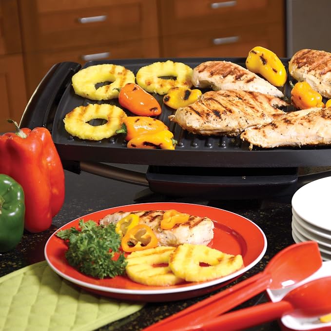 George Foreman Indoor/Outdoor Electric Grill with Stand | Indoor or outdoor electric grill with nonstick surface, 5 heat settings and fat-removing drip tray for healthier grilling.