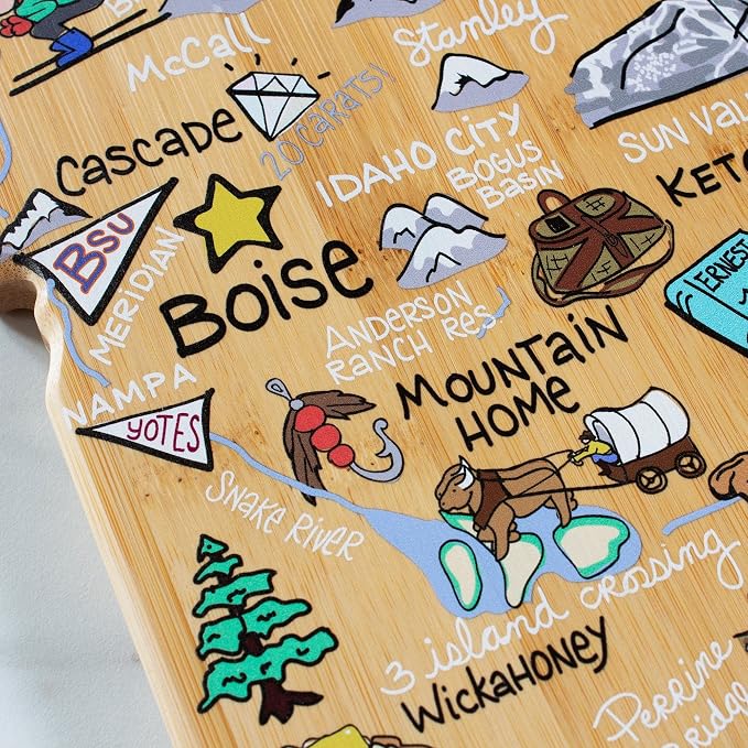 Totally Bamboo Idaho State Shaped Cutting Board, Art by Fish Kiss | State charcuterie board with colorful hand-drawn map artwork. Smooth reverse side for food prep. Hang tie for wall display.
