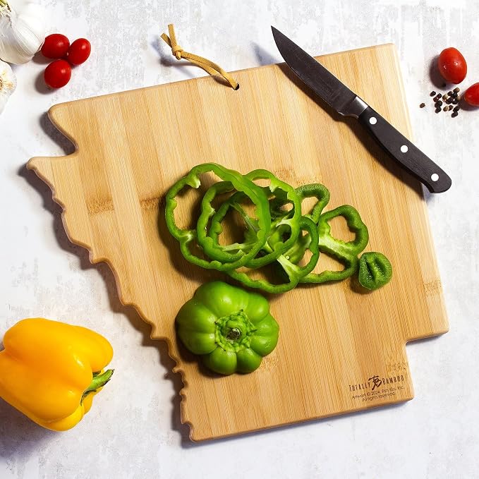 Totally Bamboo Arkansas State Shaped Cutting Board, Art by Fish Kiss | State charcuterie board with colorful hand-drawn map artwork. Smooth reverse side for food prep. Hang tie for wall display.