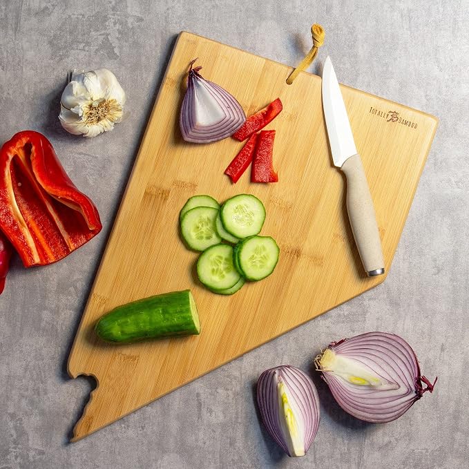 Totally Bamboo Nevada State Shaped Cutting Board, Art by Fish Kiss | State charcuterie board with colorful hand-drawn map artwork. Smooth reverse side for food prep. Hang tie for wall display.