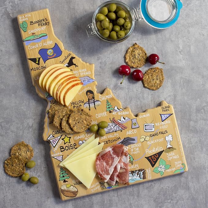 Totally Bamboo Idaho State Shaped Cutting Board, Art by Fish Kiss | State charcuterie board with colorful hand-drawn map artwork. Smooth reverse side for food prep. Hang tie for wall display.