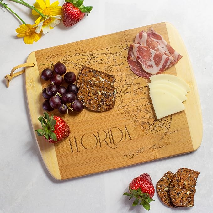 Totally Bamboo A Slice of Life Florida Engraved Map Cutting Board | 11” x 8.75” charcuterie board with engraved state map artwork. Smooth reverse side for food prep. Hang tie for wall display.