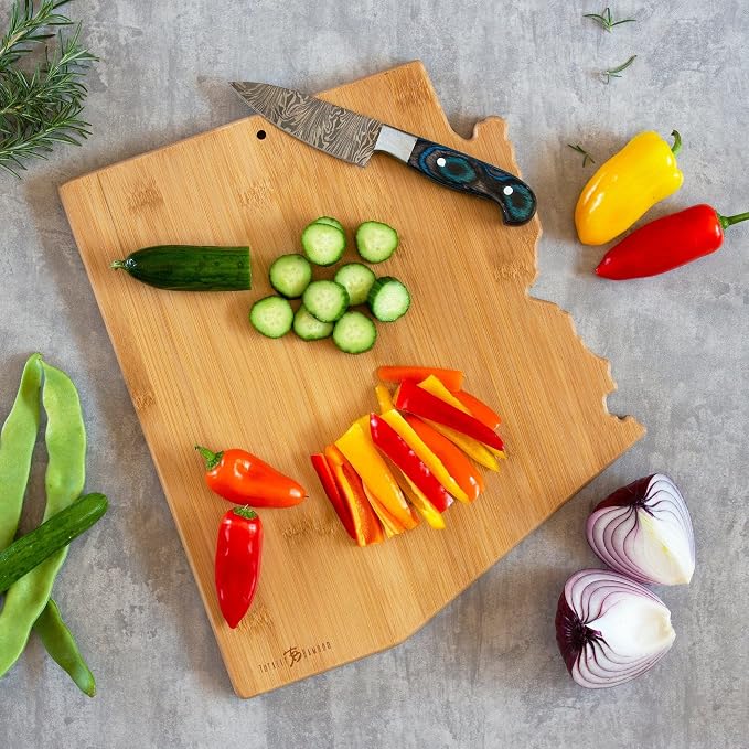 Totally Bamboo Arizona State Shaped Cutting Board, Art by Fish Kiss | State charcuterie board with colorful hand-drawn map artwork. Smooth reverse side for food prep. Hang tie for wall display.