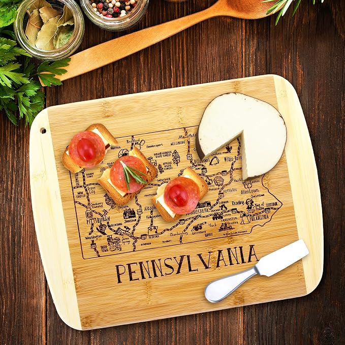 Totally Bamboo A Slice of Life Pennsylvania Engraved Map Cutting Board | 11” x 8.75” charcuterie board with engraved state map artwork. Smooth reverse side for food prep. Hang tie for wall display.