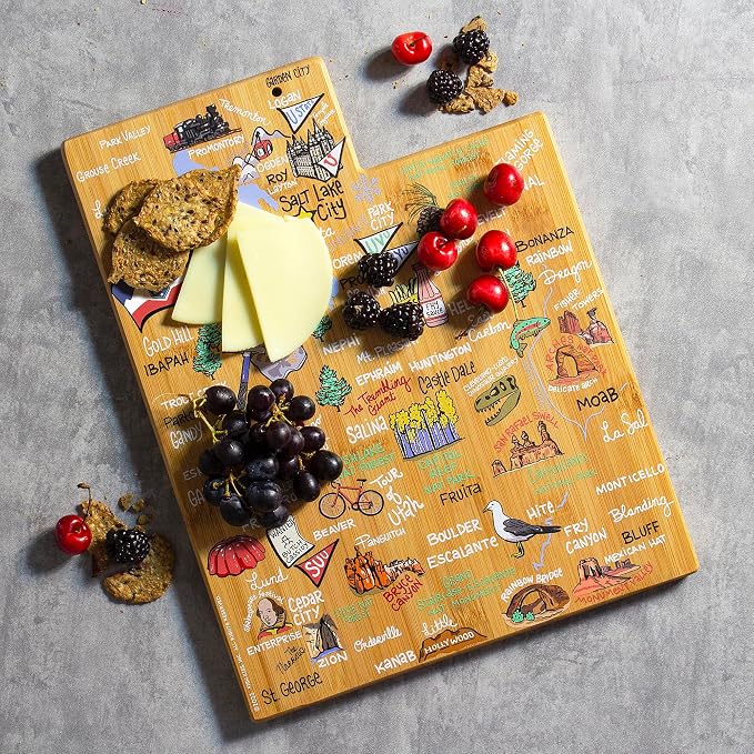 Totally Bamboo Utah State Shaped Cutting Board, Art by Fish Kiss | State charcuterie board with colorful hand-drawn map artwork. Smooth reverse side for food prep. Hang tie for wall display.